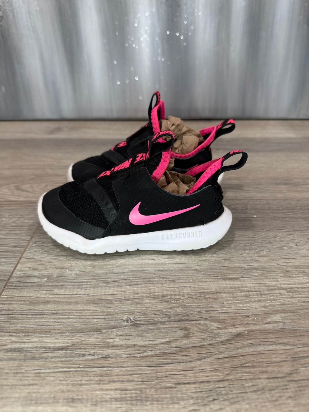 Nike Kids Black and Pink Slip-On Sneakers